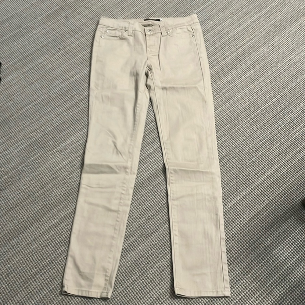 Women’s barely worn beige skinny jeans. Size 27.